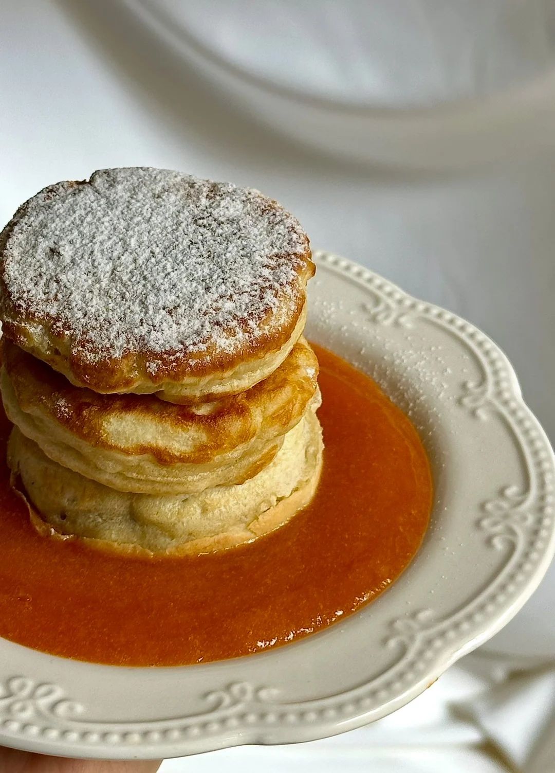 Pancakes with apricot jam and sour cream
